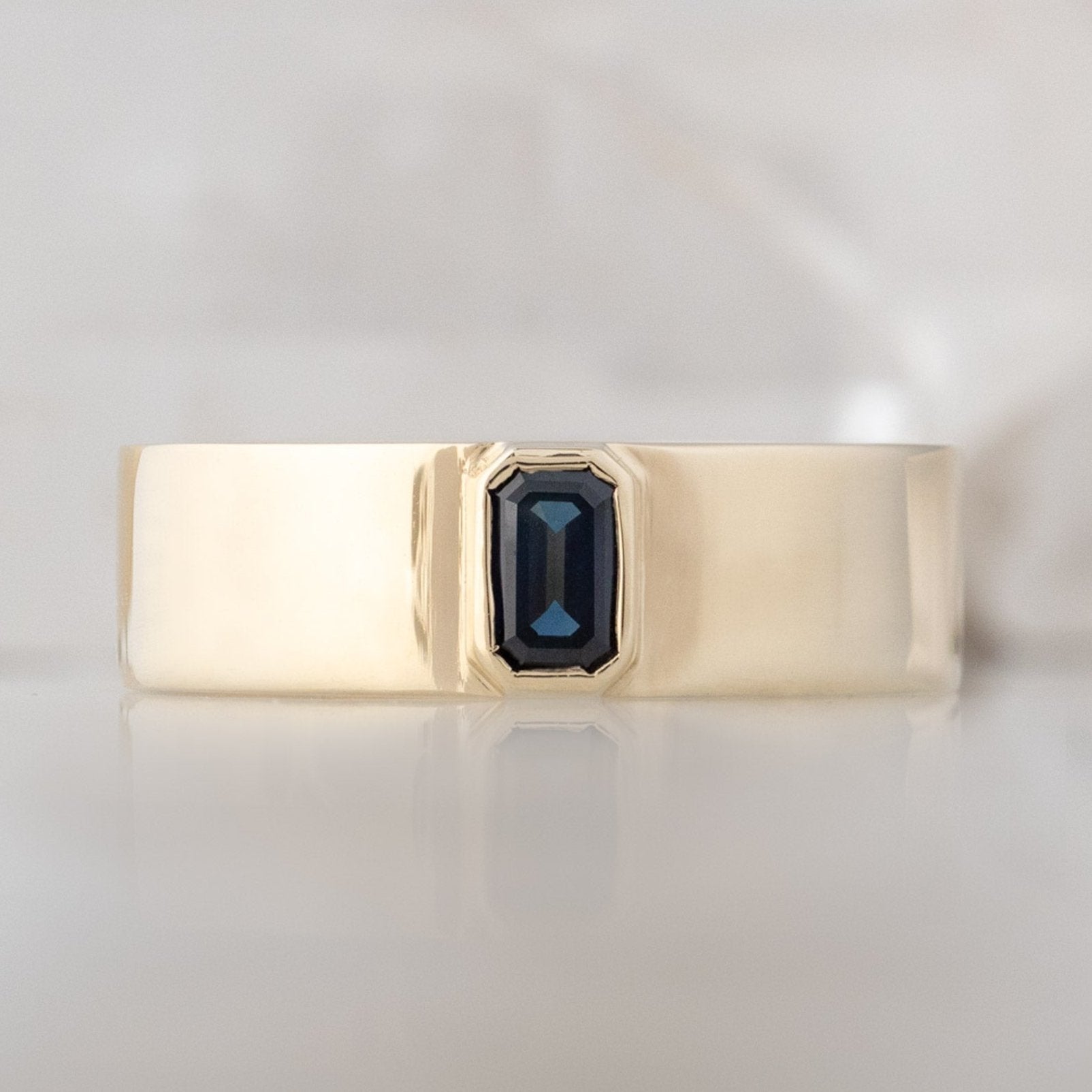Alexis Russell Engagement Rings The Cigar Band with an Emerald-Cut Blue Sapphire | Yellow, Rose or White Gold