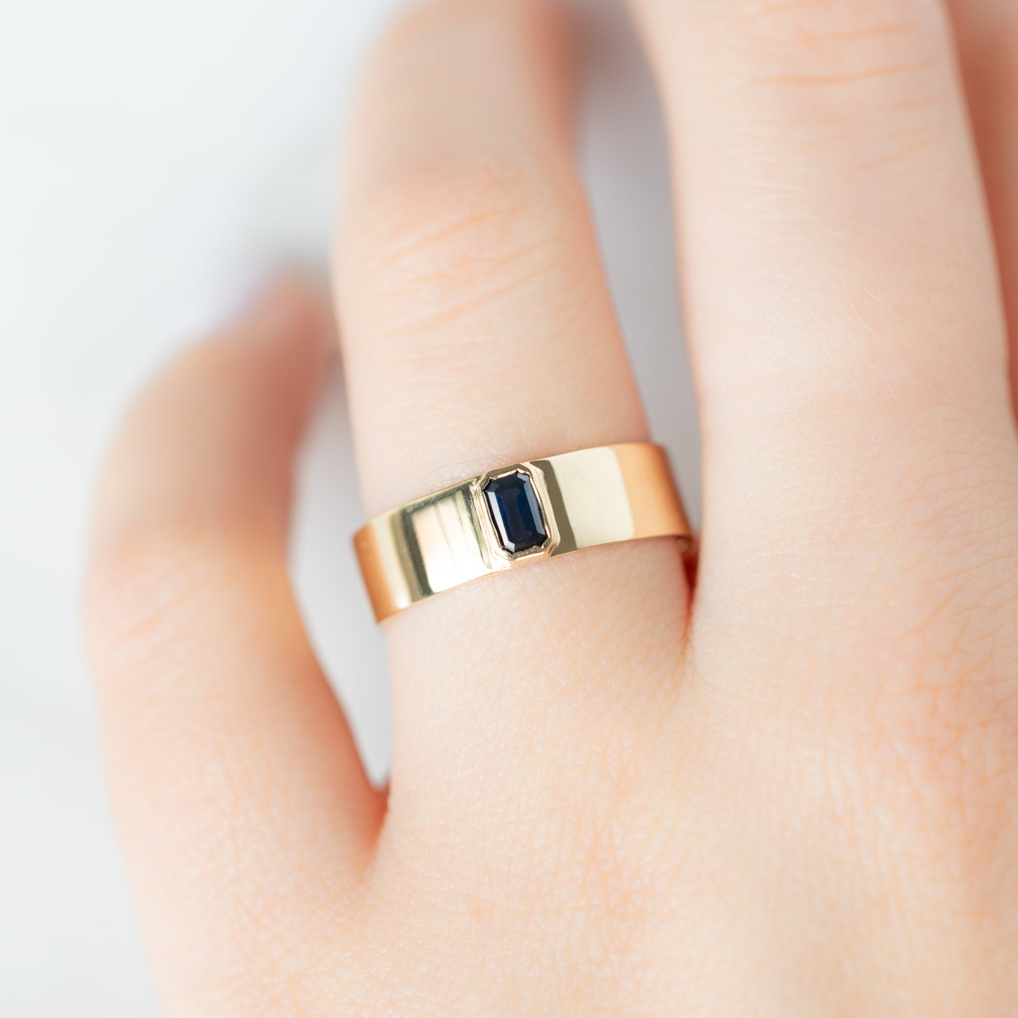 Alexis Russell Engagement Rings The Cigar Band with an Emerald-Cut Blue Sapphire | Yellow, Rose or White Gold
