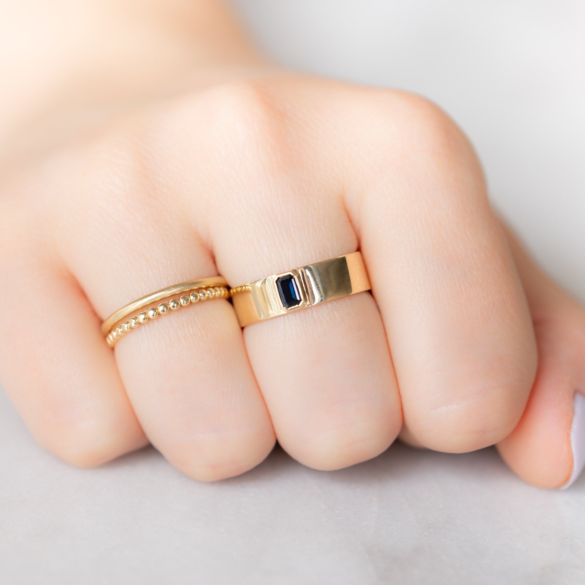 Alexis Russell Engagement Rings The Cigar Band with an Emerald-Cut Blue Sapphire | Yellow, Rose or White Gold