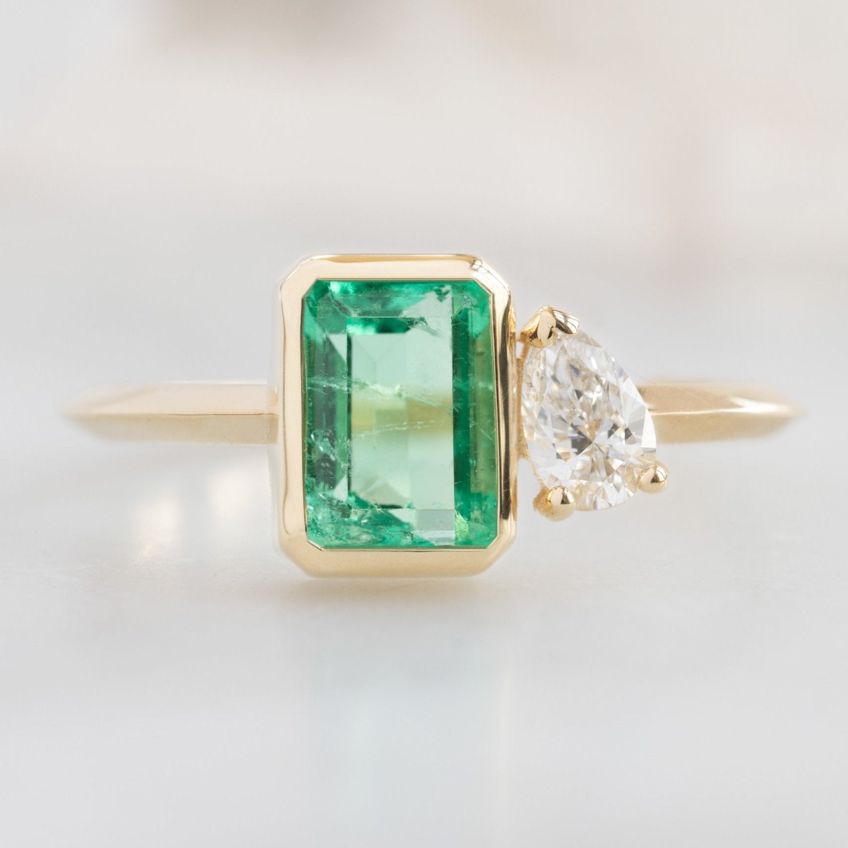 Alexis Russell Engagement Rings The You and Me Ring | 0.99ct Emerald-Cut Emerald in 14K Yellow Gold