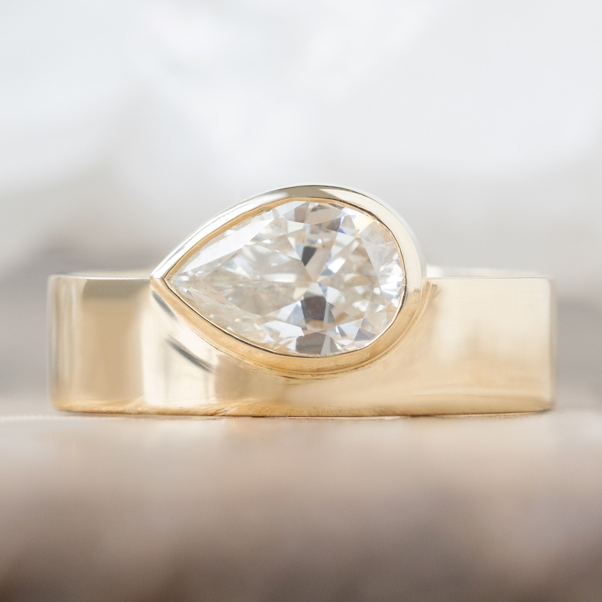 Alexis Russell Engagement Rings The Cigar Band | 0.91ct Pear Natural White Diamond in 14K Yellow Gold