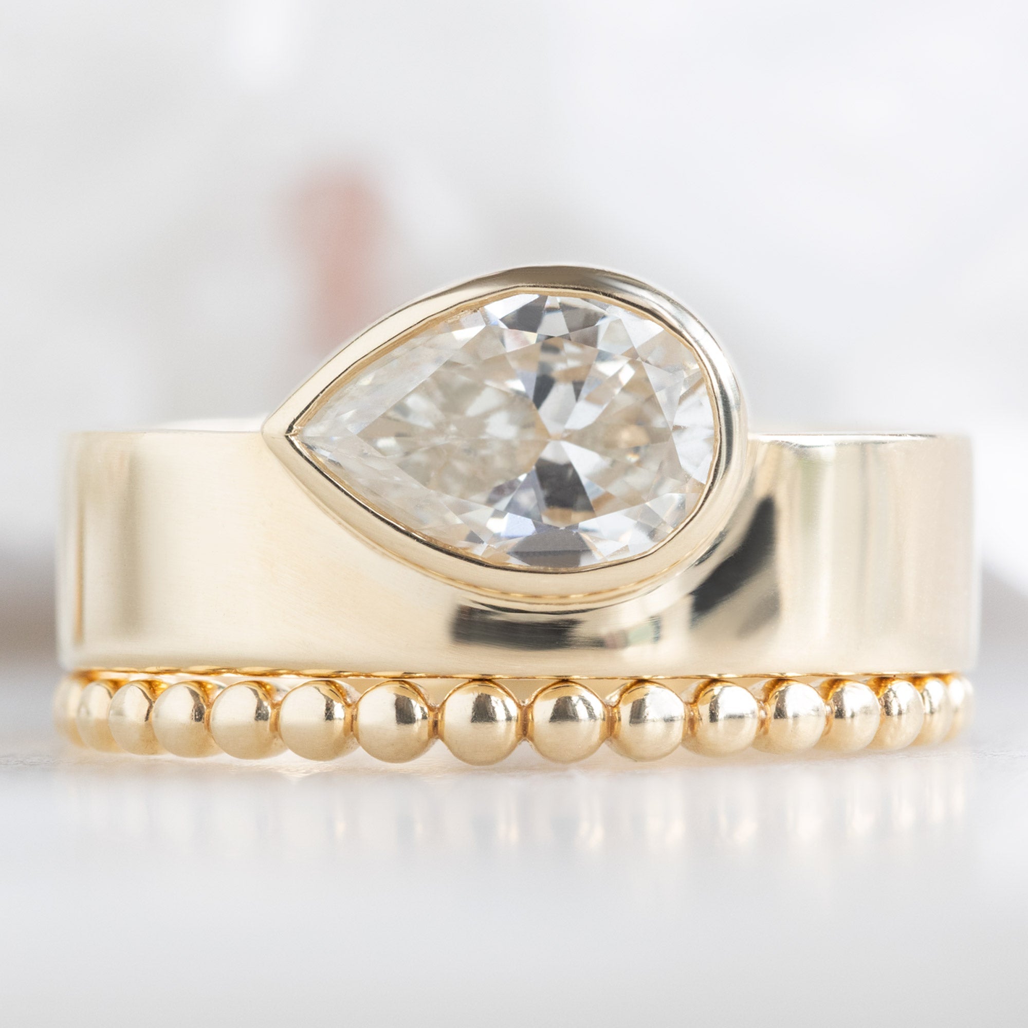Alexis Russell Engagement Rings The Cigar Band | 0.91ct Pear Natural White Diamond in 14K Yellow Gold