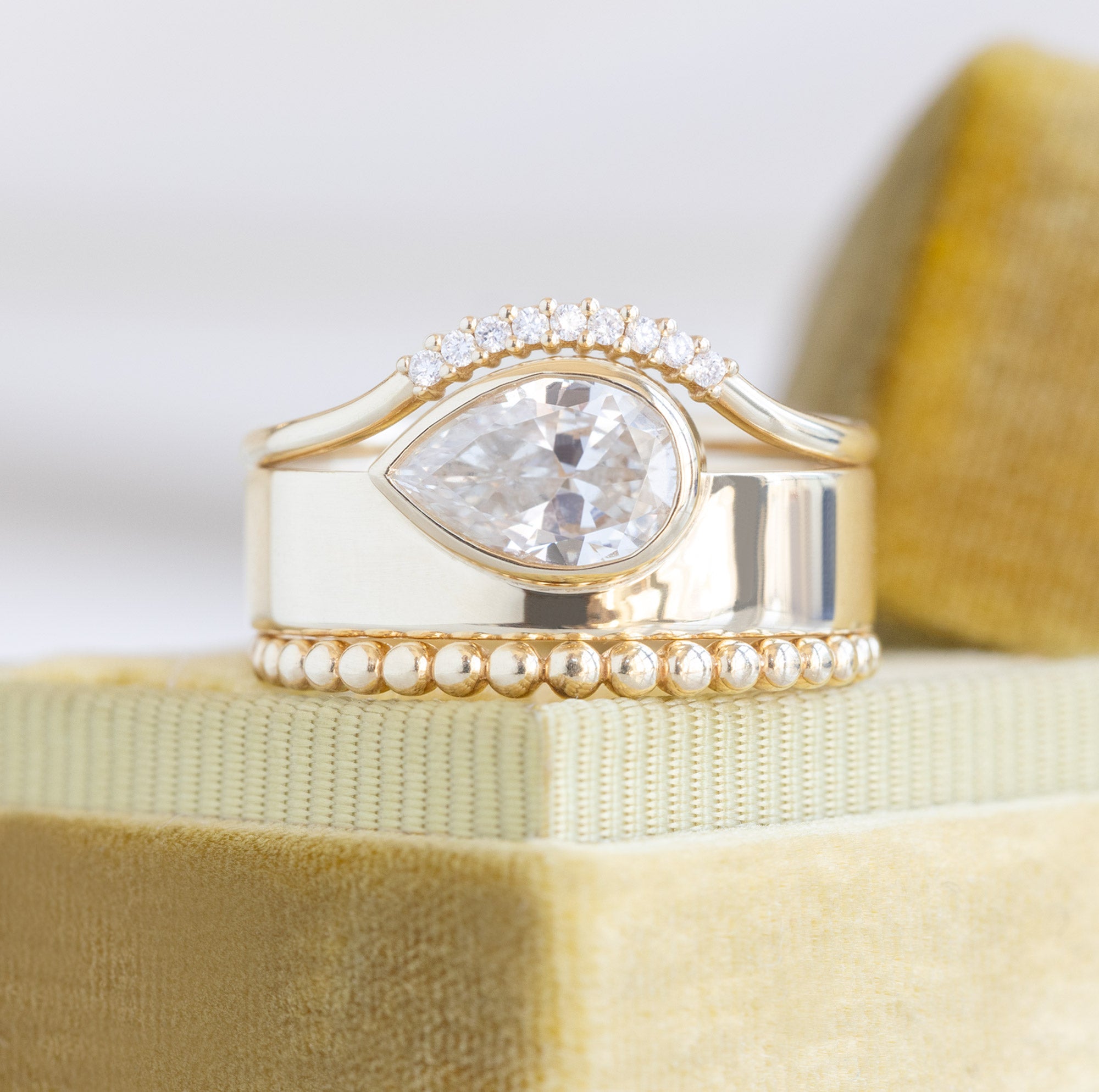 Alexis Russell Engagement Rings The Cigar Band | 0.91ct Pear Natural White Diamond in 14K Yellow Gold