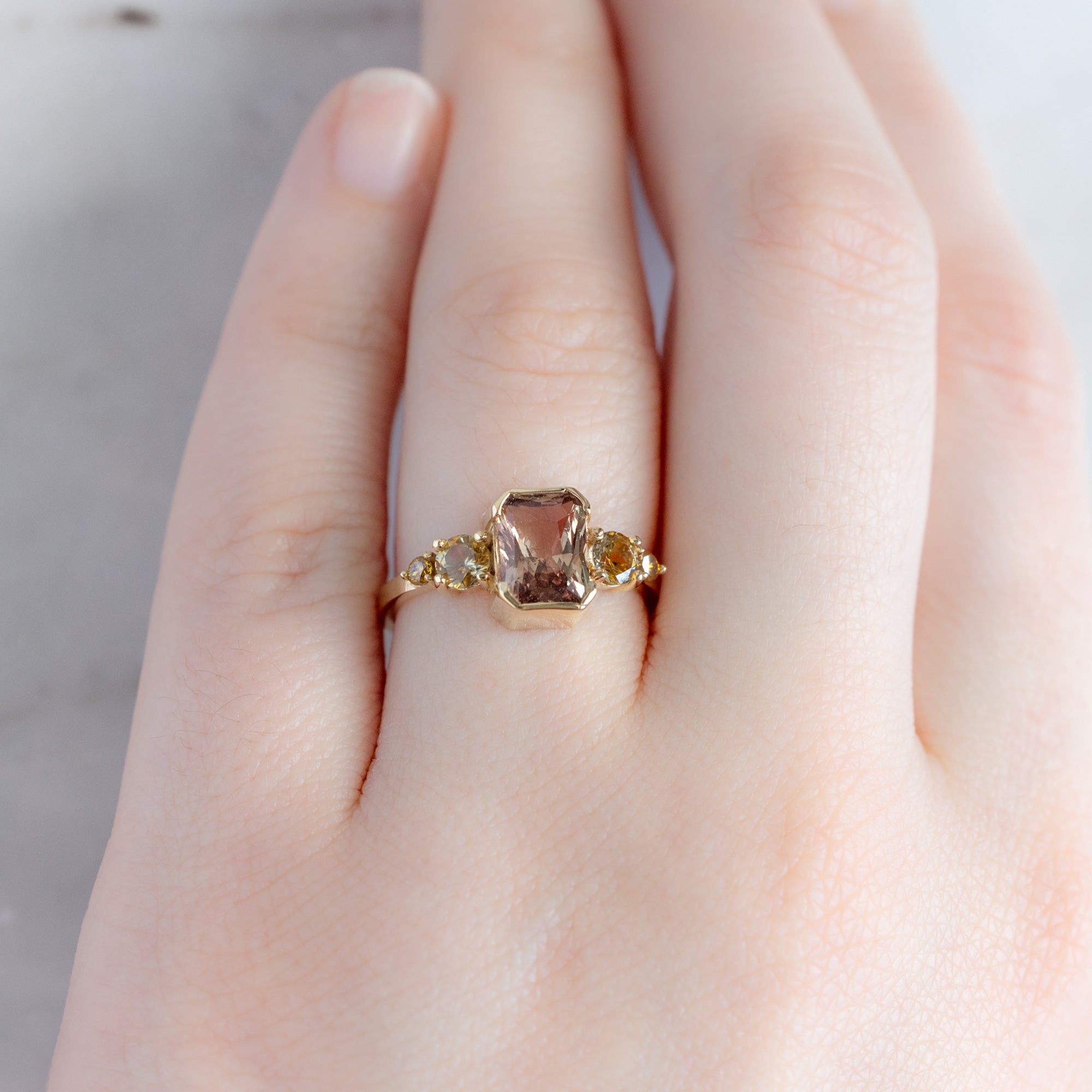 Alexis Russell Engagement Rings The Watercolor Ring | 2.04ct Emerald Cut Peach Sapphire in 14K Yellow Gold