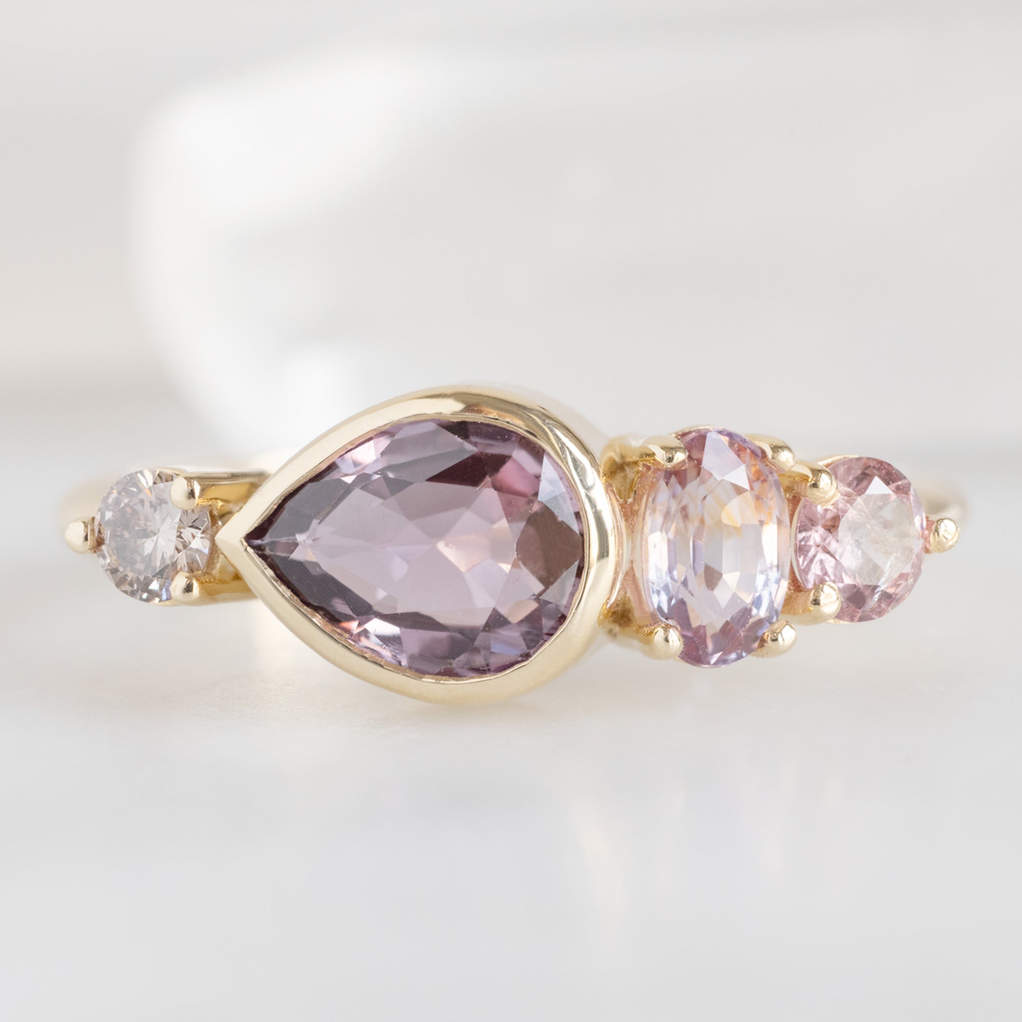 Alexis Russell Engagement Rings The Watercolor Line Ring | 1.27ct Pear Magenta Sapphire in 14K Yellow Gold