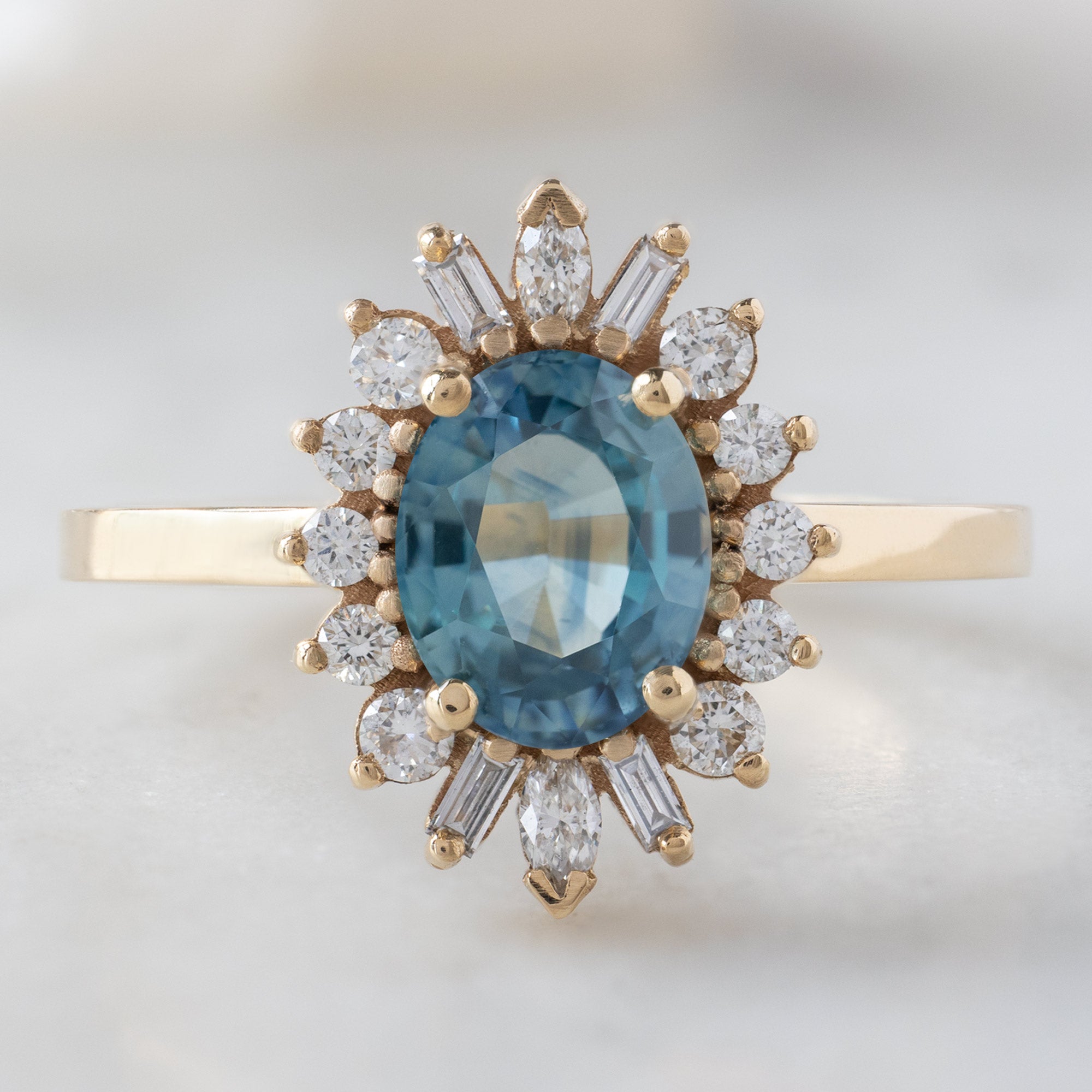 Alexis Russell Engagement Rings The Camellia Ring | 1.32ct Oval Blue Montana Sapphire in 14K Yellow Gold