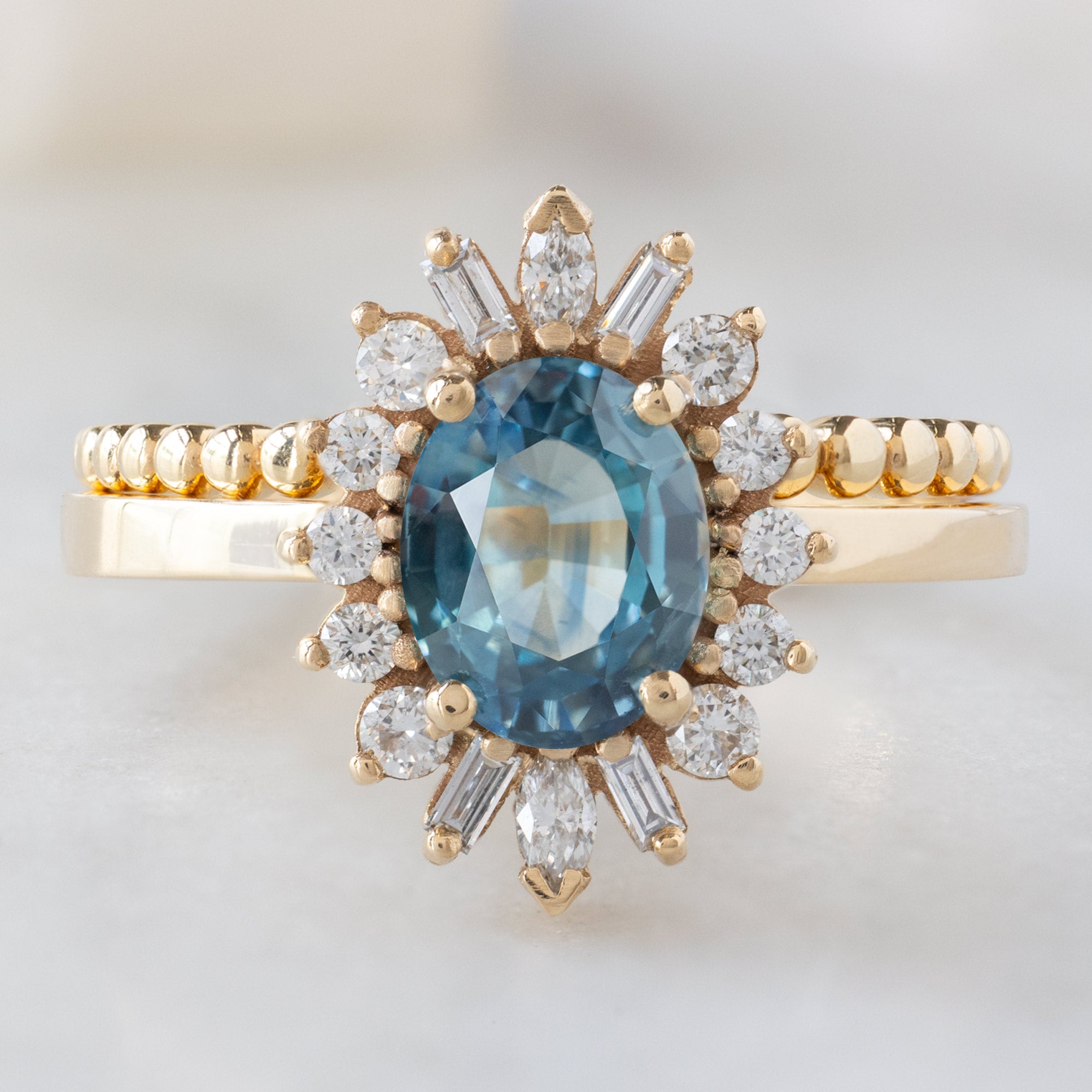 Alexis Russell Engagement Rings The Camellia Ring | 1.32ct Oval Blue Montana Sapphire in 14K Yellow Gold