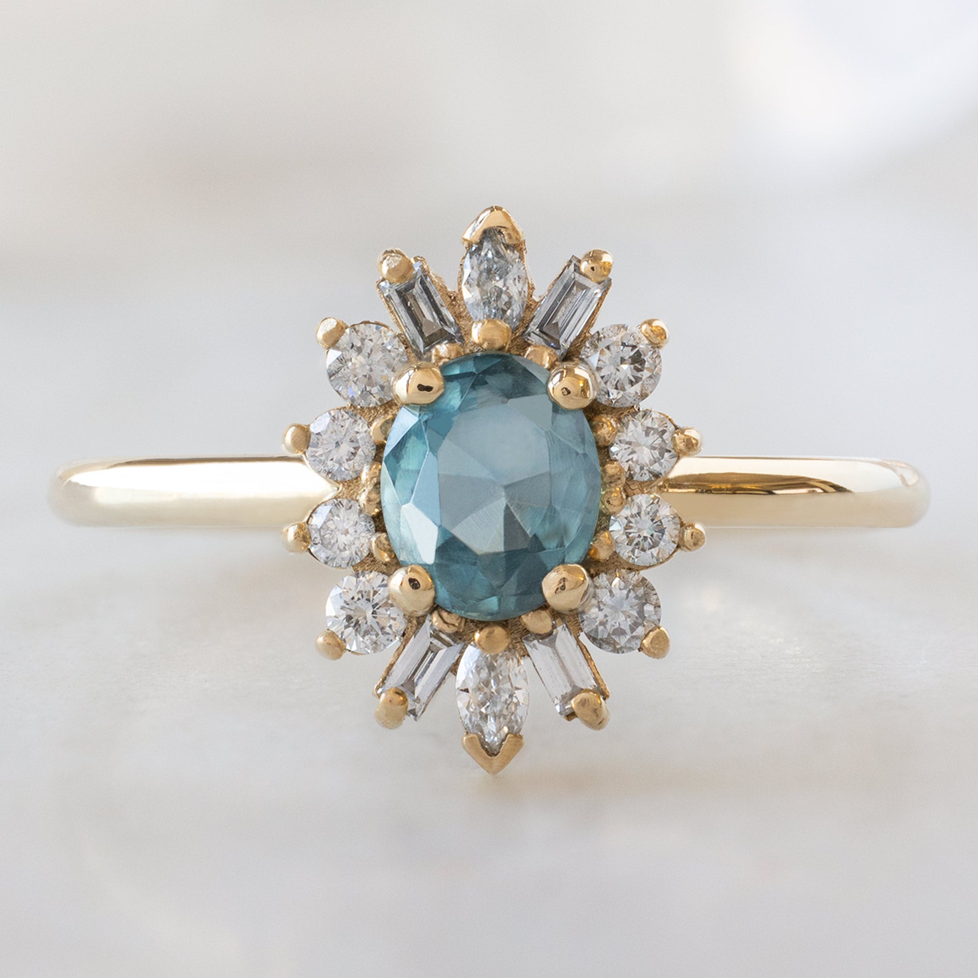 Alexis Russell  Engagement Rings The Camellia Ring | 0.81ct Oval Blue Montana Sapphire in 14K Yellow Gold