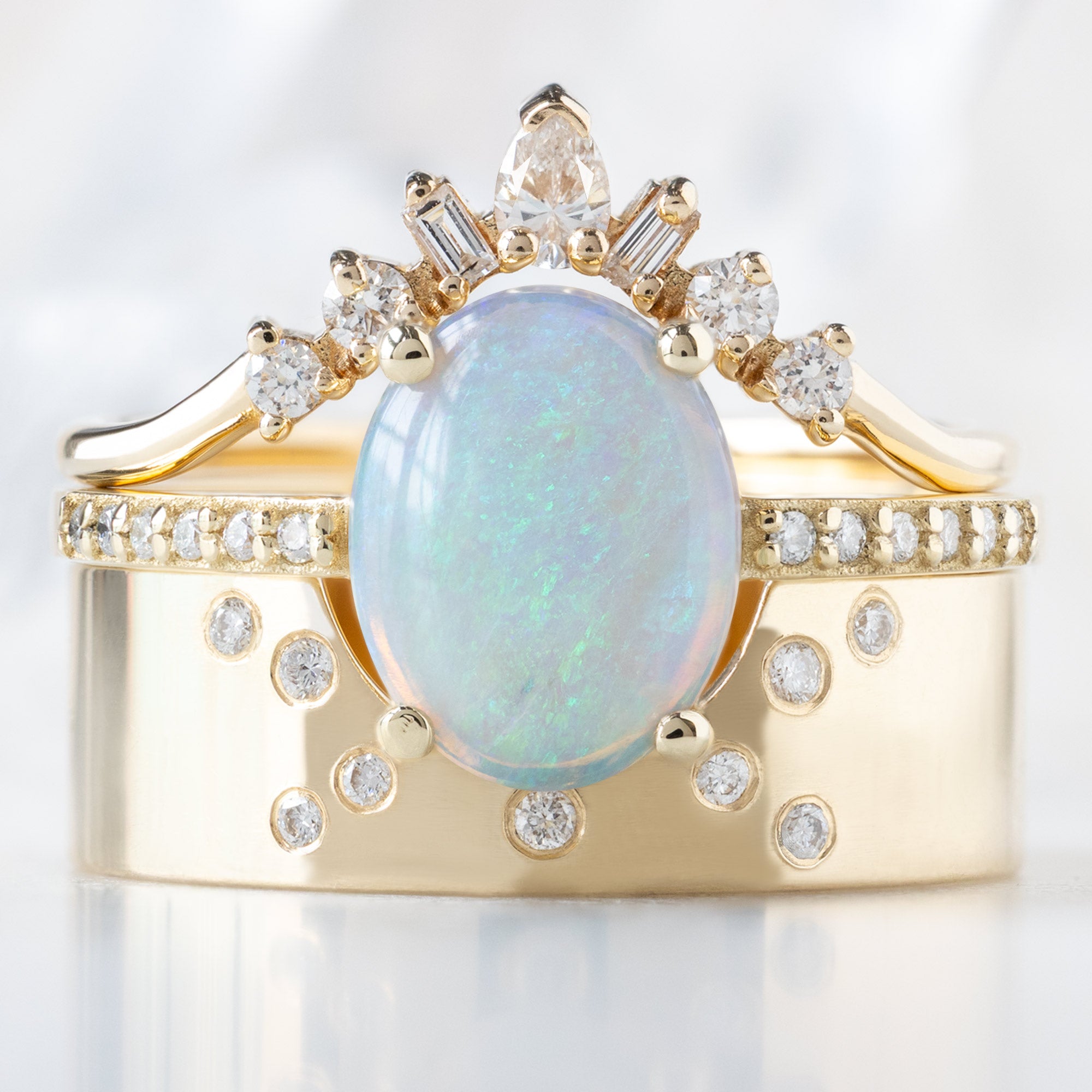 buy:geometric-white-diamond-sunburst-stacking-band-14k-or-18k-yellow-gold,the-willow-ring-1-01ct-australian-cabochon-oval-opal-in-14k-yellow-gold,constellation-cut-out-stacking-band-arc-cut-out-in-14k-yellow-gold