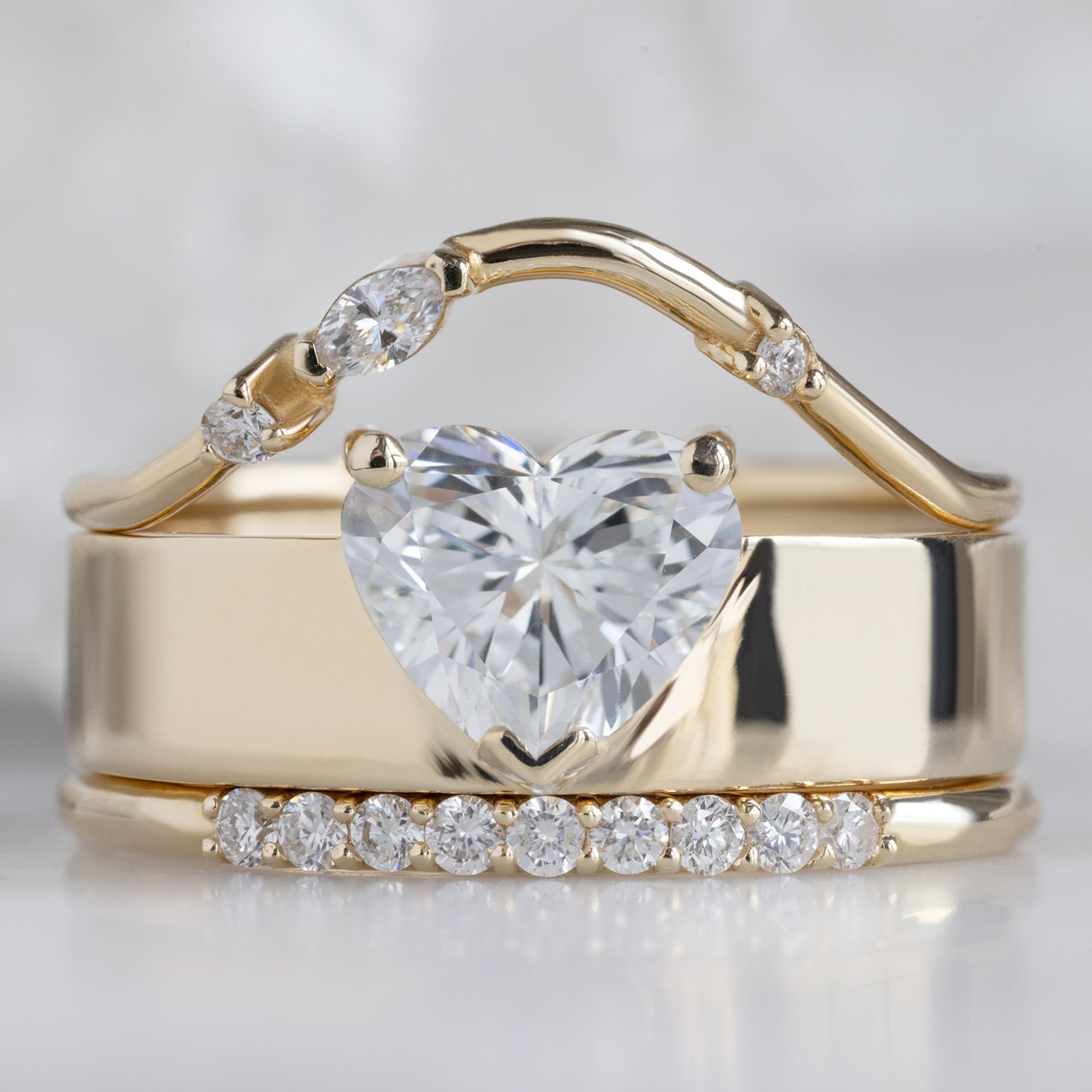 buy:asymmetrical-marquise-diamond-arc-stacking-band-in-14k-yellow-gold,the-cigar-ring-1-03ct-lab-heart-white-diamond-in-14k-yellow-gold,the-luxe-white-diamond-pave-wedding-band-yellow-rose-or-white-gold