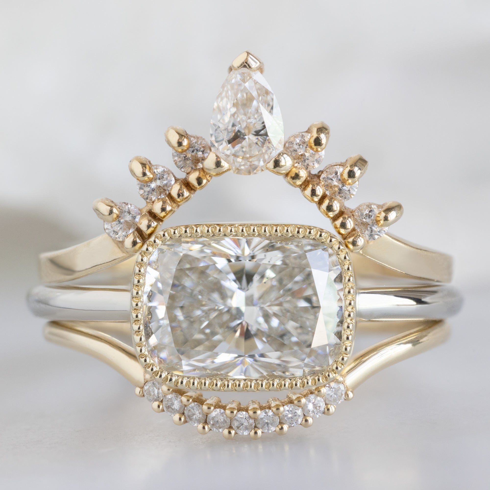 buy:white-pear-diamond-sunburst-stacking-band-14k-gold,the-milgrain-hazel-ring-2-08ct-lab-grown-cushion-cut-white-diamond-in-14k-yellow-gold,white-diamond-pave-arc-stacking-band-14k-or-18k-yellow-gold