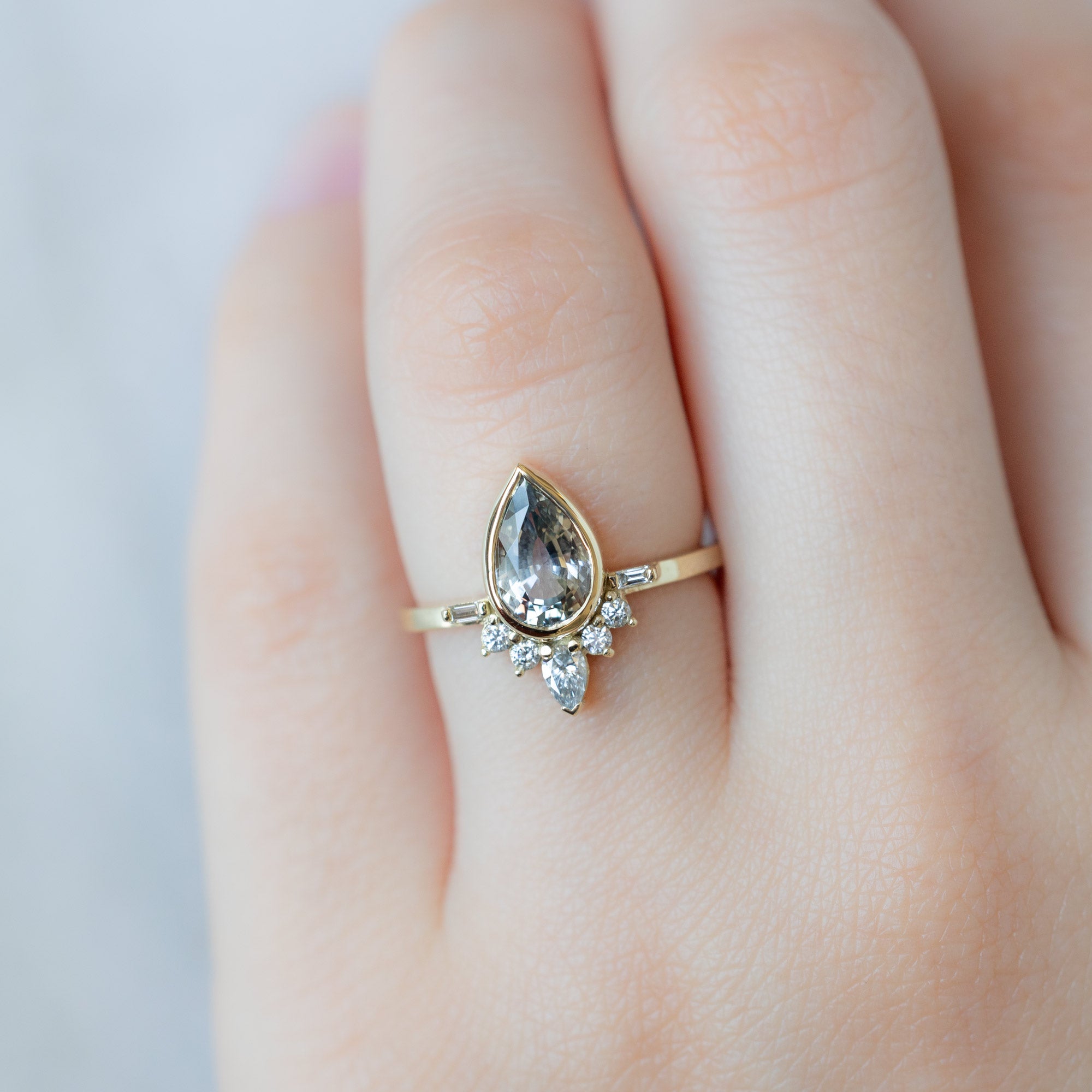 Alexis Russell  Engagement Rings The Watercolor Posy Ring | 1.96ct Pear Icy Blue Sapphire in 14K Yellow Gold