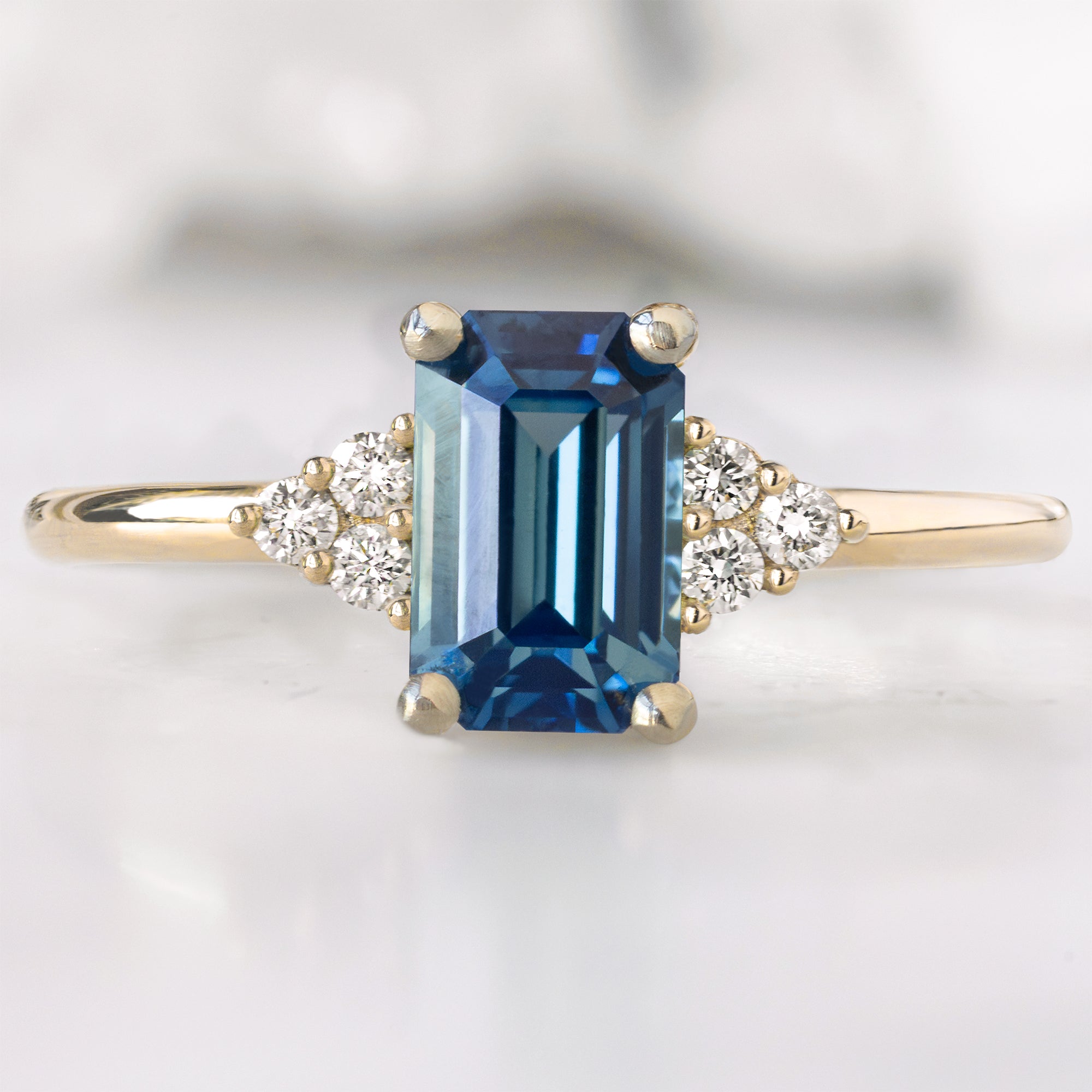 Alexis Russell  Engagement Rings The Ivy Ring | with a 1.2ct Emerald Cut Blue Sapphire in 14K Yellow Gold