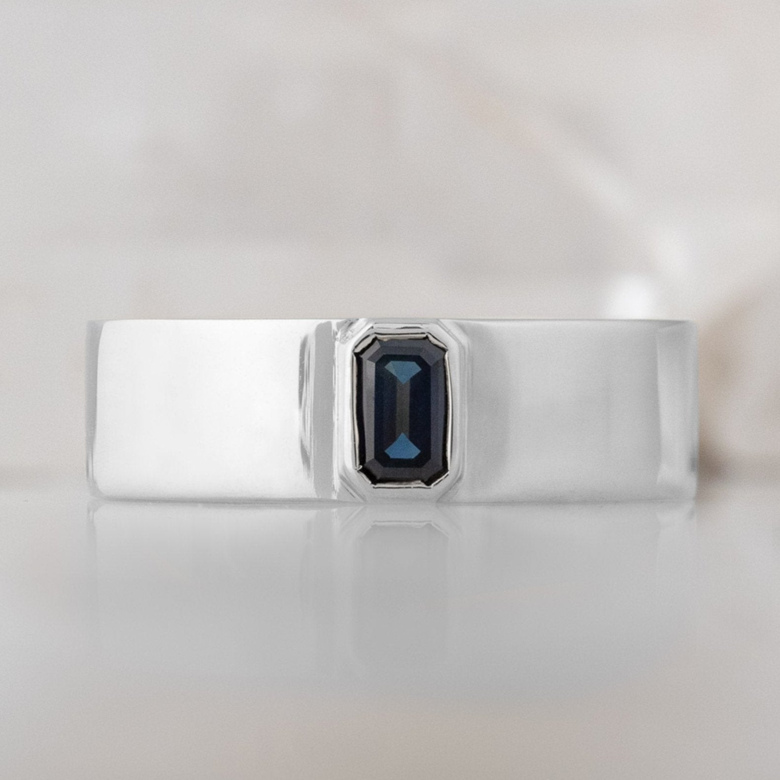 Alexis Russell Engagement Rings The Cigar Band with an Emerald-Cut Blue Sapphire | Yellow, Rose or White Gold