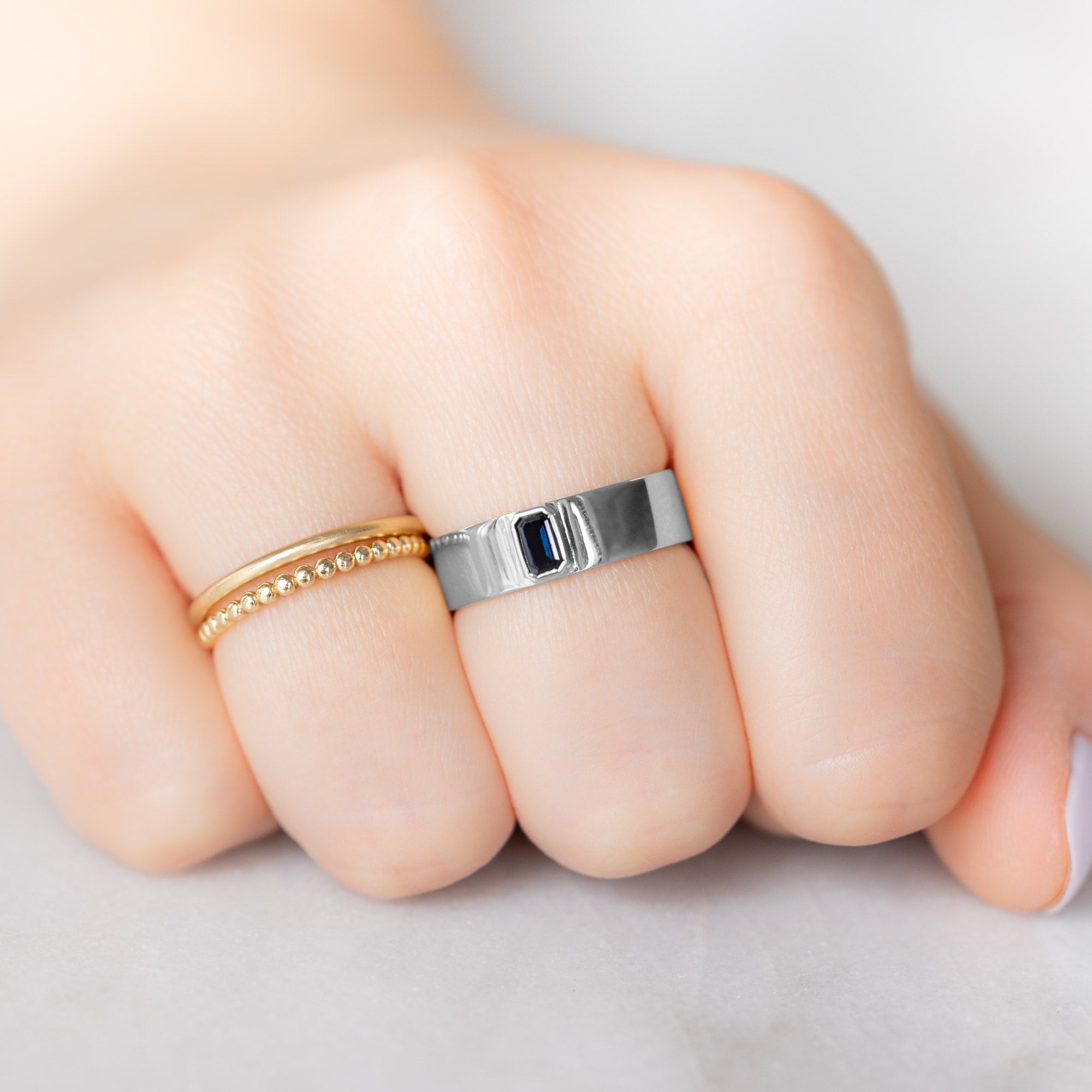 Alexis Russell Engagement Rings The Cigar Band with an Emerald-Cut Blue Sapphire | Yellow, Rose or White Gold