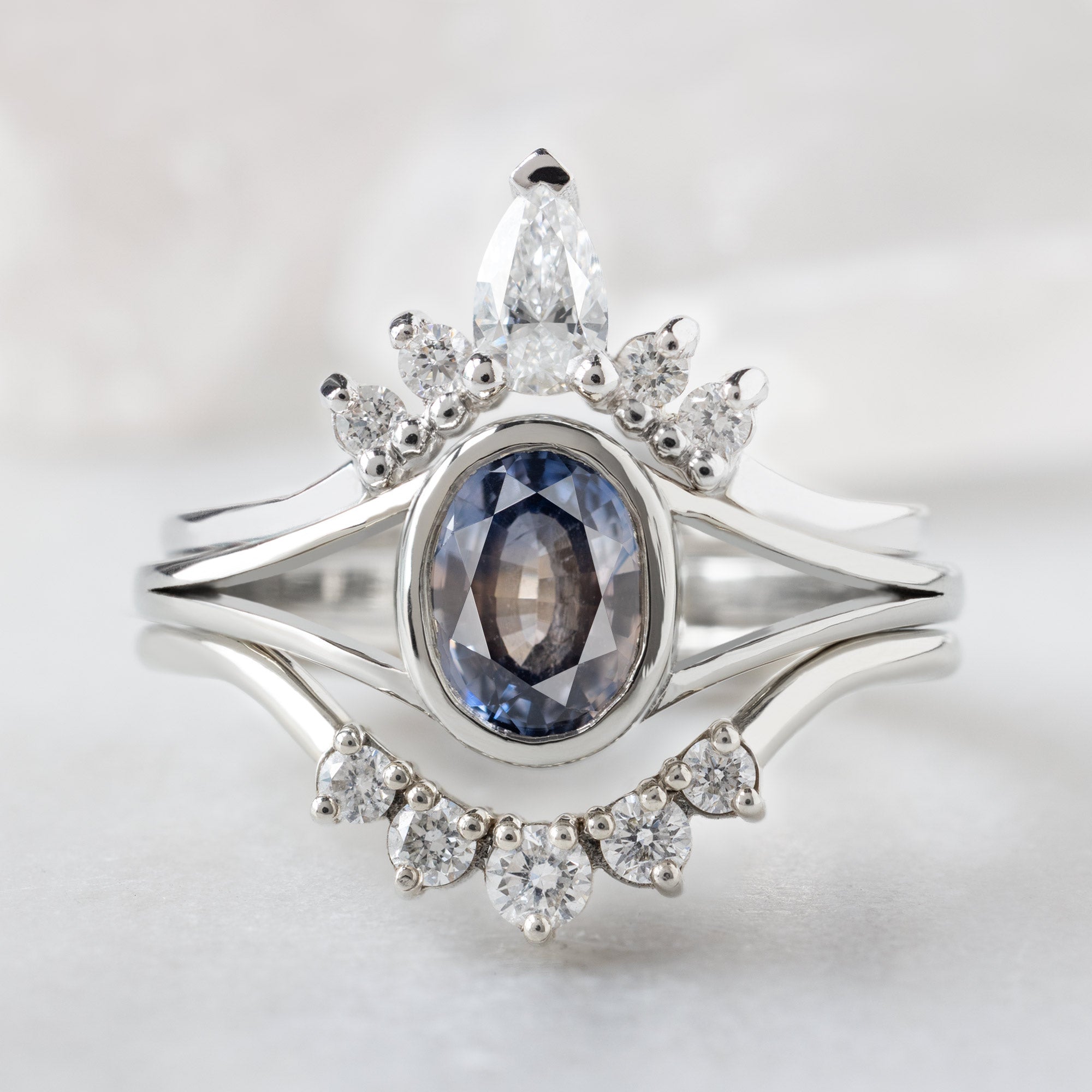 buy:white-pear-diamond-sunburst-stacking-band-14k-gold,the-watercolor-magnolia-ring-1-22ct-oval-parti-sapphire-in-14k-white-gold,round-white-diamond-sunburst-stacking-band-14k-or-18k-yellow-gold
