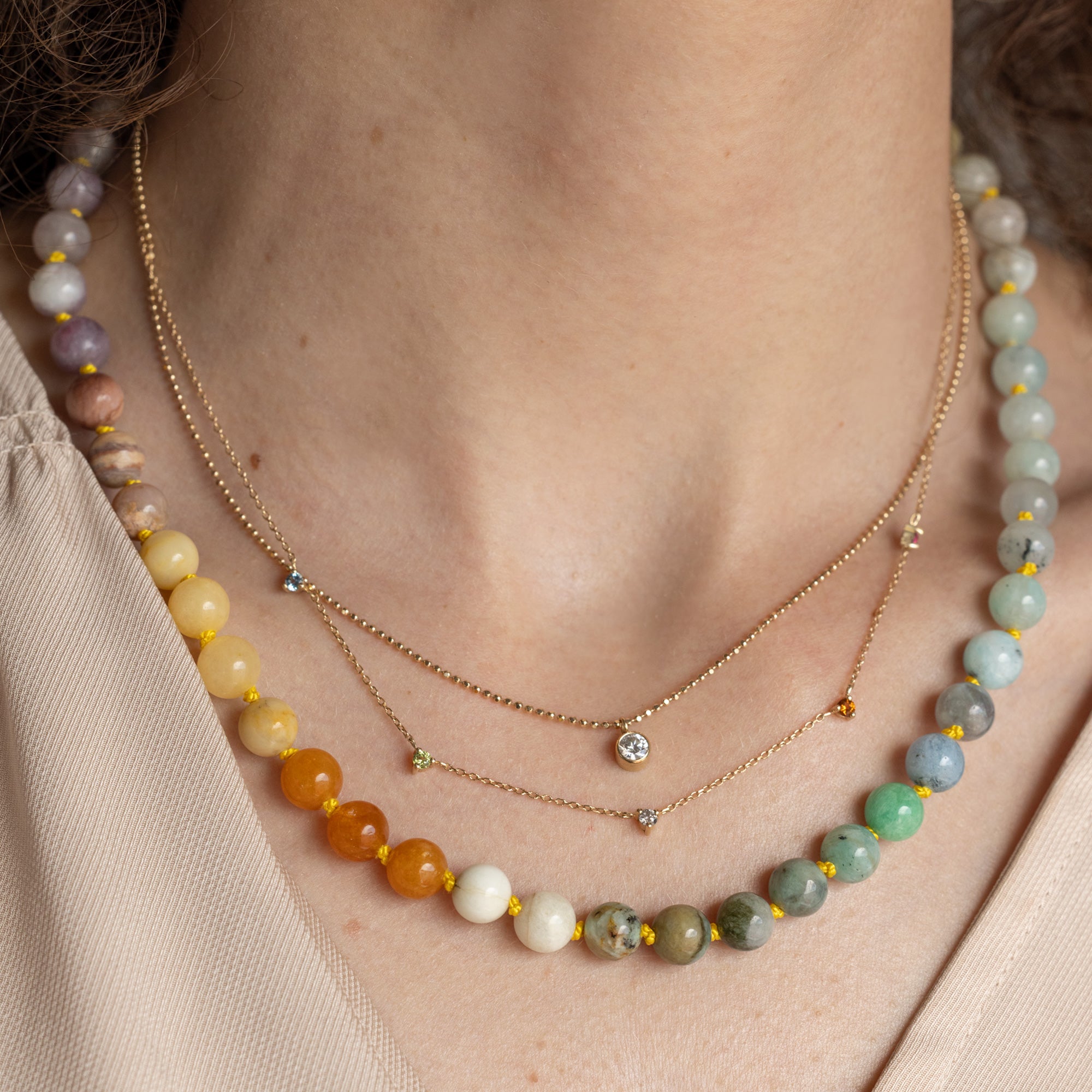 buy:not-your-typical-solitaire-diamond-necklace-10k-yellow-gold,the-diamond-sunburst-necklace-10k-yellow-gold,found-objects-beaded-gemstone-necklace